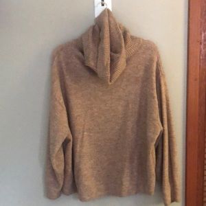 Tan coloured cowl-style turtle neck sweater